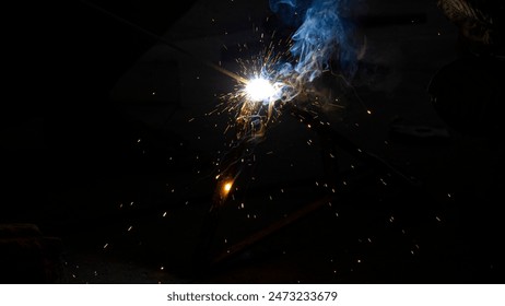 Welding Closeup. Bright Sparks and Smoke Looks Very Beautiful.  - Powered by Shutterstock