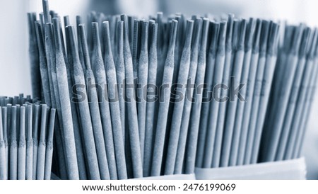 Welding electrode rods, electrodes stacked vertically together