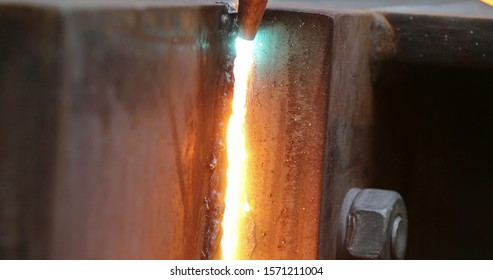 Welding Metal Iron, Sparks Falling To The Ground