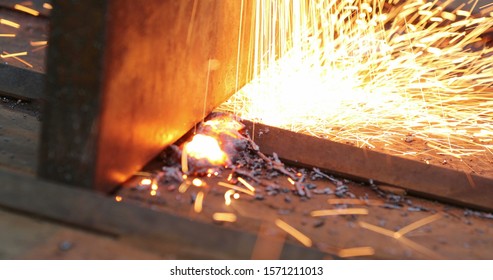 Welding Metal Iron, Sparks Falling To The Ground