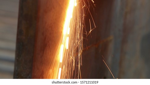 Welding Metal Iron, Sparks Falling To The Ground