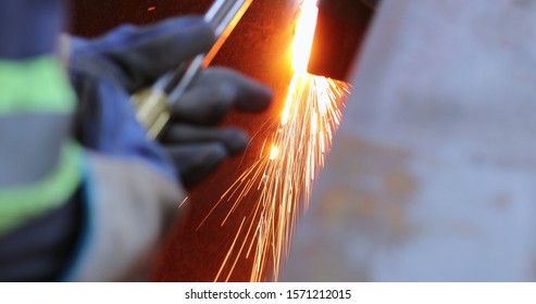 Welding Metal Iron, Sparks Falling To The Ground