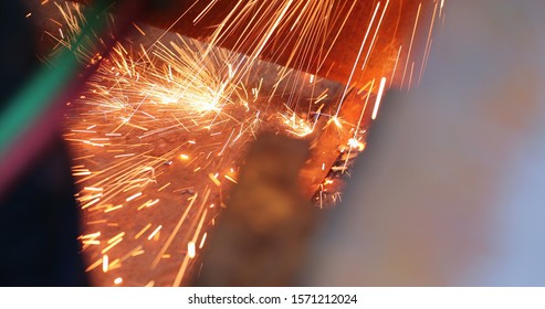 Welding Metal Iron, Sparks Falling To The Ground