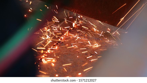 Welding Metal Iron, Sparks Falling To The Ground