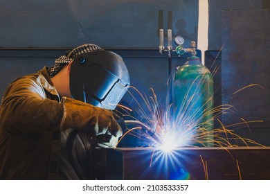 Welding of metal structures by semi-automatic arc welding. MIG MAG welding method. - Shutterstock ID 2103533357