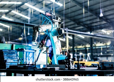 Welding Robot In Production Plant Or Factory