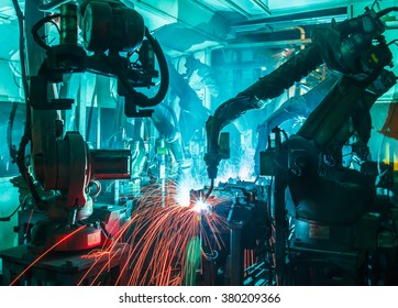 Welding Robots Movement In A Car Factory