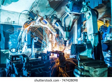 Welding Robots Movement In A Car Factory