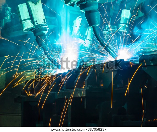 Welding robots movement\
in a car factory