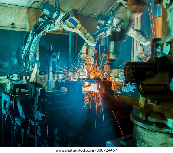 Welding robots movement\
in a car factory