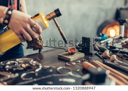 Similar – Image, Stock Photo Crop master welding metal pieces at workbench