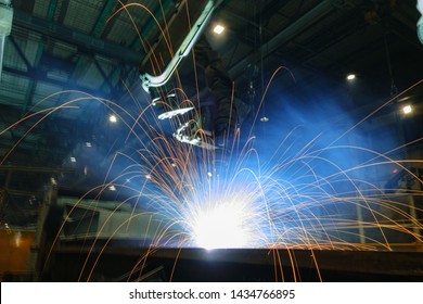Welding Sparks  From Robot  In Manufacturing With Blur Focus, Used Is Background