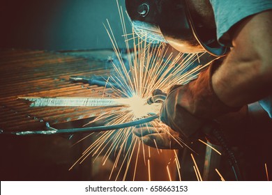 Welding Work. Erecting Technical Steel Industrial Steel Welder In Factory. Craftsman. Soft focus. Shallow DOF