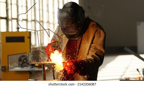 Welding Worker In Safety Mask