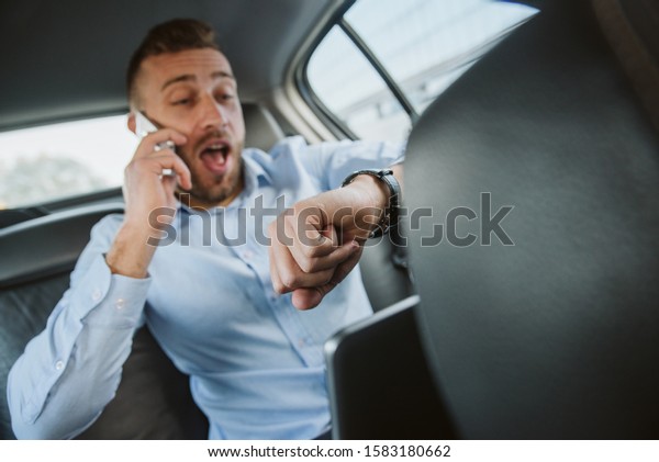 We\'ll be late for\
work! Businessman in a\
car