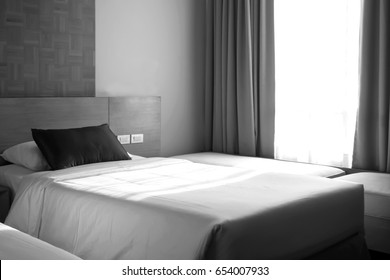 Well Bed In Bedroom. Sunlight Through Pass Made Shade And Shadow. Art Background. Black And White Theme.