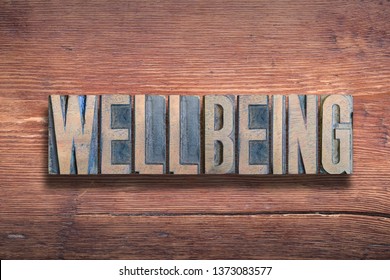 well being word combined on vintage varnished wooden surface - Shutterstock ID 1373083577