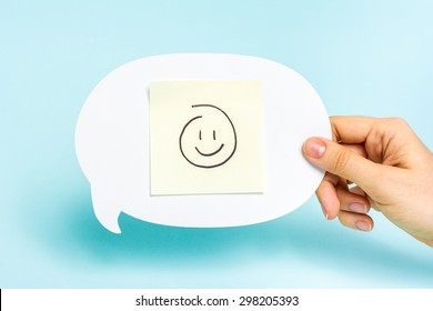 Well Done, Card Feedback, Employee Recognition Concept. Happy Emoticon On Speech Bubble On Blue Background. Chatbot.