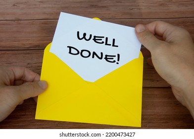 Well Done Text On White Notepad With Hand Opening The Envelope. Motivational Concept.