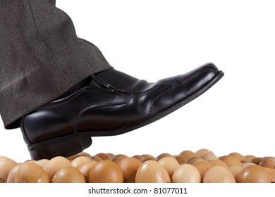 Well Dressed Man Walking On Egg Shells, White Background.