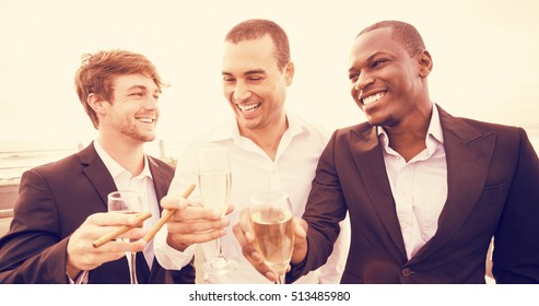 Well Dressed Men Drinking Champagne Next To Limousine On Night Out