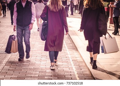 Well Dressed People Walking Down London High Street With Shopping Bags