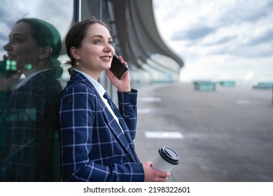 Well Dressed Young Businesswoman With Her Smart Phone