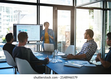 Well Get There If We Work Together. Cropped Shot Of A Young Businesswoman Giving A Presentation In The Boardroom.