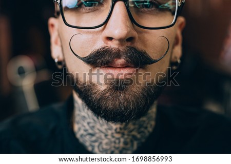 Well groomed hipster. Barbershop concept. Beauty industry. Facial hair care. Mature man bearded hipster with long beard and mustache. Styling mustache. Growing long mustache. Moustache style. Foto d'archivio © 