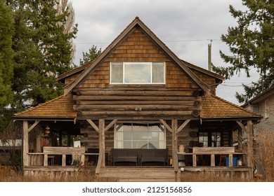 Well Kept Wooden House From The 60s Or Later. North American Home From The Sixties Or Seventies. Street Photo, Selective Focus, Nobody