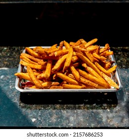 Well Lit French Fries On Marbel Countertop 