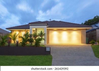 Well Lit Modern Home Exterior At Dusk