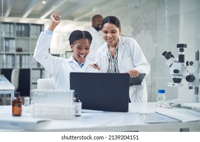 Well make history with this. Shot of a group of scientists cheering while working in a lab. - Powered by Shutterstock