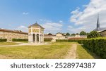 The Well of Moses, a masterpiece of Burgundian Gothic sculpture by Claus Sluter, located in the park of the Chartreuse de Champmo in the city of Dijon in France on August 20, 2024.