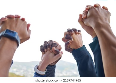 Well Rise Together. Closeup Shot Of A Group Of Unrecognisable People Holding Hands While Exercising Outdoors.