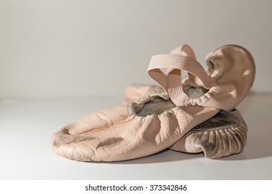 well worn ballet slippers