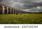 The Welland Viaduct crosses the valley of the River Welland under gray cloudy sky