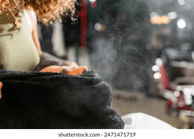 In a well-appointed barbershop, a man receives a hot towel facial treatment from a skilled barber, part of an upscale grooming ritual focusing on man’s skincare and relaxation. - Powered by Shutterstock