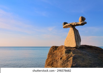 Well-balanced of pebbles on the top of boulder - Shutterstock ID 298378682