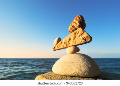 Well-balanced stack of pebbles of each other - Shutterstock ID 348381728