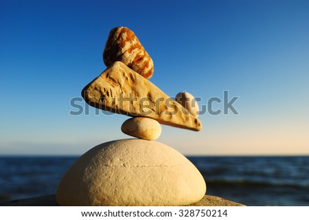 Well-balanced stack of pebbles on the shore