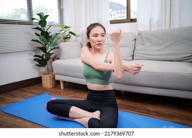 Wellbeing Concept. Young Woman Exercising Before Training At Home.
