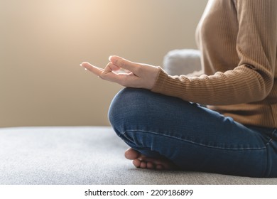 Wellbeing Peaceful Mind Lifestyles,  Close Up Hand Of Young Asian Women Focus On Breath Harmony To Refresh Mindfulness On Sofa In The Living Room At Home.