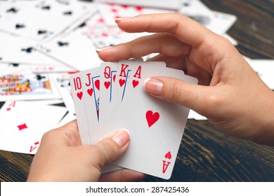 Well-conditioned Female Hands Holding Playing Cards With Poker Strongest Combination - Royal Flush