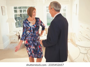 Well-dressed mature woman posing for husband