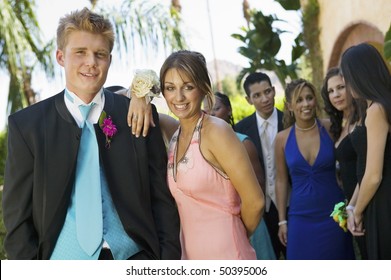 Well-dressed Teenage Couple Standing Outside School Dance