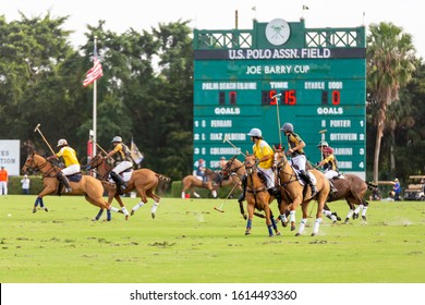 Wellington, Florida/USA - January 12, 2020: Joe Barry Cup Final at International Polo Club. Polo jockeys on horseback playing on the 300 yards long field.