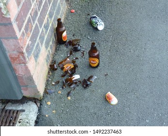 Wellington, New Zealand, August 2012: Broken Tui Beer Bottles On The Sidewalk / Footpath 