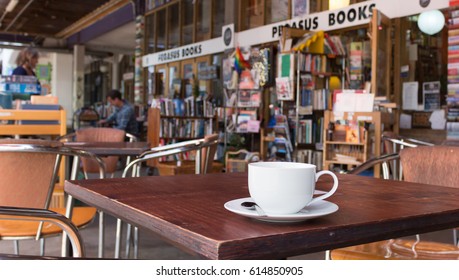 Wellington, New Zealand - February 10, 2017: A Cup Of Coffee Outside At The Pegasus Book Store.