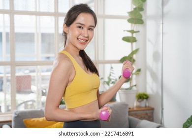 Wellness Healthy Lifestyles, Cheerful Asian Woman Lifting Weight And Body Care Exercise During Stay Home